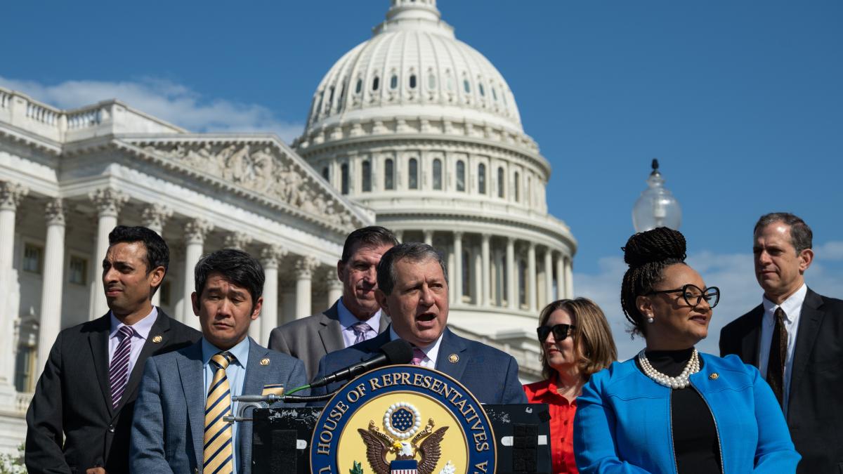 Congressman Morelle stands at a podium speaking in front of the Capitol dome.