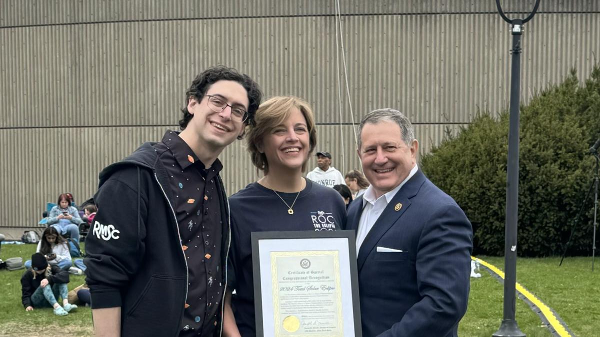 Joe, Hillary, and Dan pose at RMSC for a photo