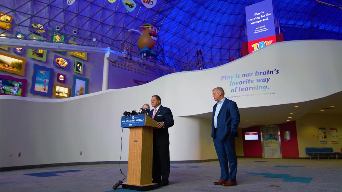 Congressman Morelle at podium at Strong Museum of Play