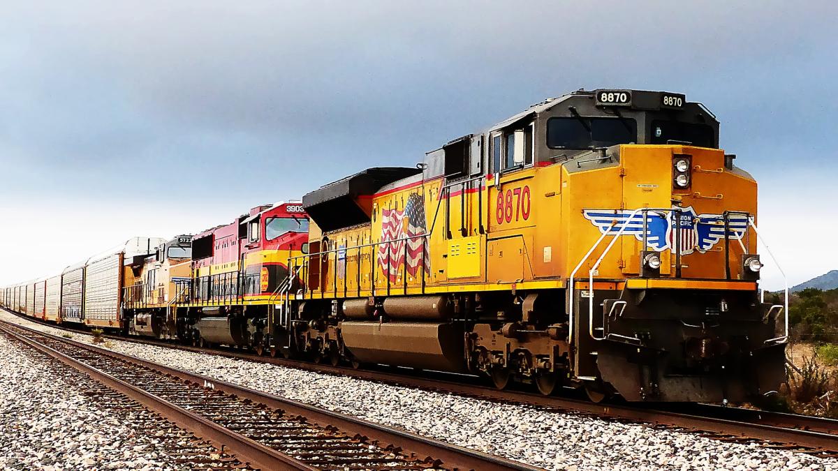 Train engine and cars on tracks