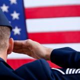 soldier saluting the US flag