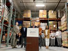 Congressman Morelle speaking at podium at Foodlink
